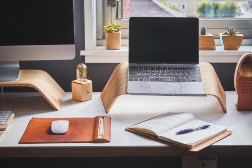 laptop, computer, notebook and mouse on a desk, mid-high shot